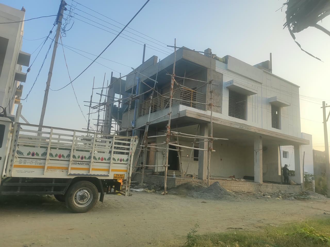 Residential building with tiled cladding facade, elevation finishing stage